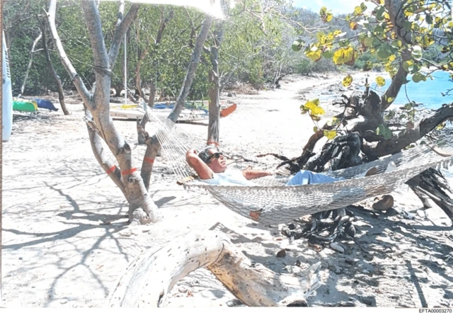 Epstein in hammock on beach