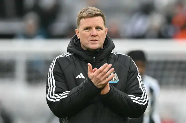 Newcastle United's English head coach Eddie Howe applauds fans on the pitch