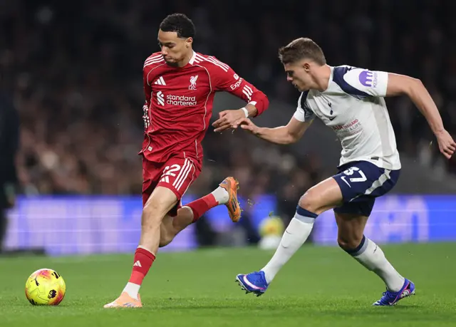 Hugo Ekitike of Liverpool runs with the ball whilst under pressure from Micky van de Ven of Tottenham Hotspur during the Premier League match between Tottenham Hotspur and Liverpool at Tottenham Hotspur Stadium on December 20, 2025 in London, England.