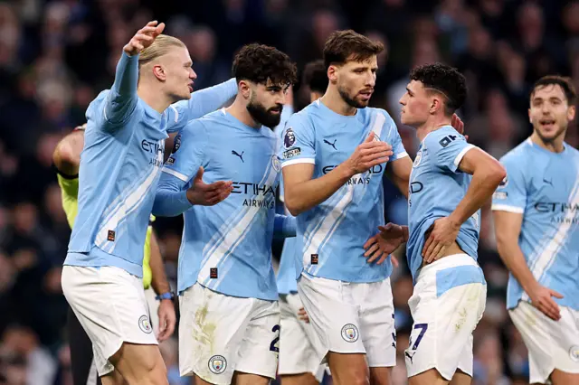 Manchester City players celebrate the team's second goal scored by Tijjani Reijnders (not pictured) during the Premier League match between Manchester City and West Ham United at Etihad Stadium on December 20, 2025 in Manchester, England. (