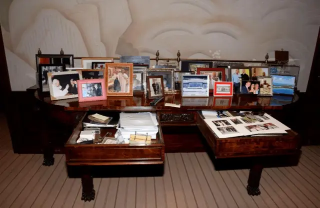 A view of drawers and framed photos shown in Jeffrey Epstein's Manhattan home are seen in this image released by the Department of Justice in Washington, DC