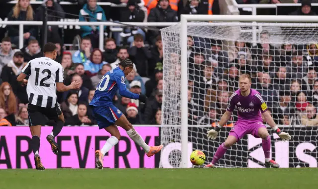 Soccer Football - Premier League - Newcastle United v Chelsea - St. James' Park, Newcastle, BritChelsea's Joao Pedro scores their second goal past Newcastle United's Aaron Ramsdale during Premier League fixture.