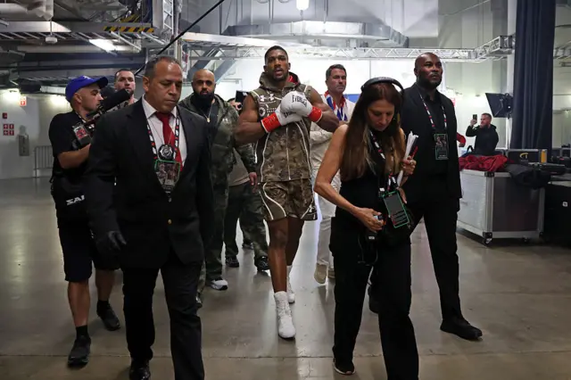 Anthony Joshua walks to the ring