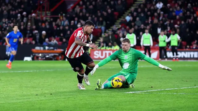 Gus Hamer rounds Ryan Allsop to score Sheffield United's second against Birmingham