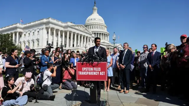 US Representative Ro Khanna (D-CA) stands in front of accusers and survivors as he speaks during a press conference to discuss the Epstein Files Transparency bill