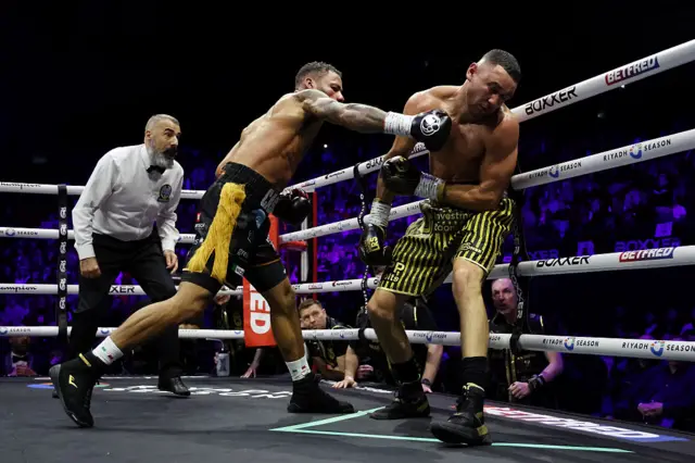 Troy Williamson punches Callum Simpson