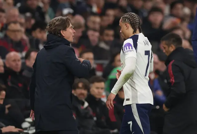 Xavi Simons of Tottenham Hotspur walks past Thomas Frank manager / head coach of Tottenham Hotspur after being shown a red card and sent off during the Premier League match between Tottenham Hotspur and Liverpool at Tottenham Hotspur Stadium on December 20, 2025 in London