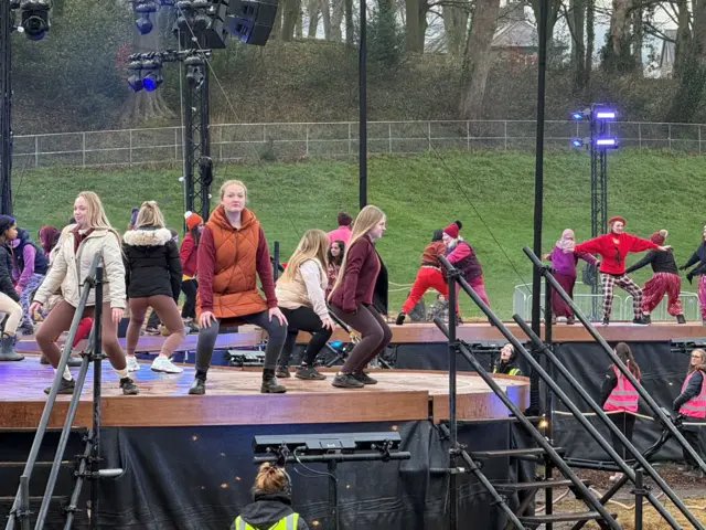 Performers rehearsing before the closing ceremony