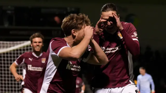 Northampton celebrate Cameron McGeehan's second goal against Wimbledon