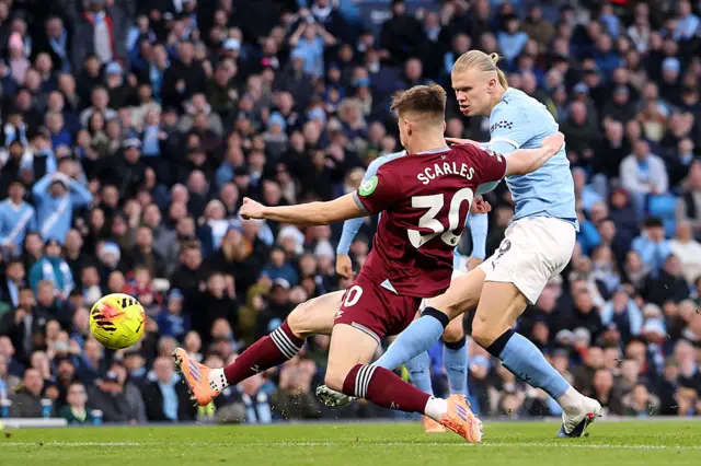 Erling Haaland of Manchester City scores his team's first goal
