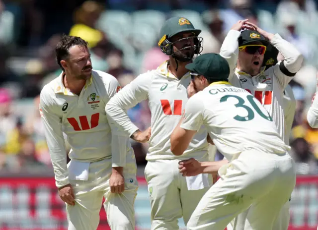 Australia react after a review is umpire's call