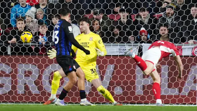 Rob Atkinson heads in Bristol City's second goal