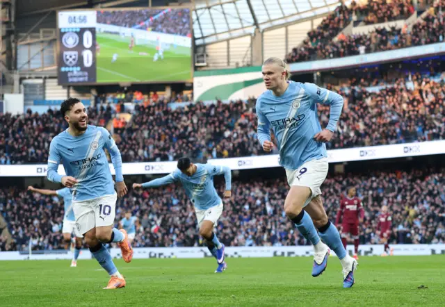 Erling Haaland of Manchester City scores his team's first goal