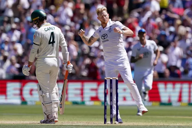England’s Ben Stokes (right) celebrates taking the wicket of Australia's Alex Carey (left) on day four of the third NRMA Insurance Ashes Series 2025 test at the Adelaide Oval, Australia
