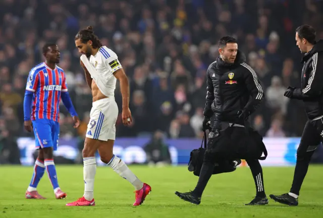 Leeds United's Dominic Calvert-Lewin walks off the pitch after receiving medical attention during Premier League clash with Crystal Palace.