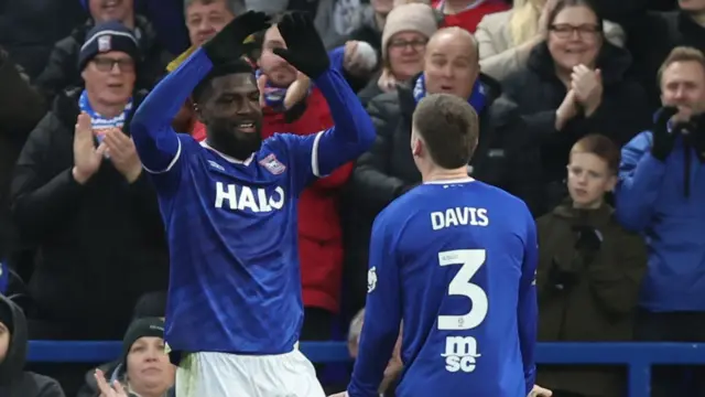 Cedric Kipre celebrates his opening goal with Leif Davis