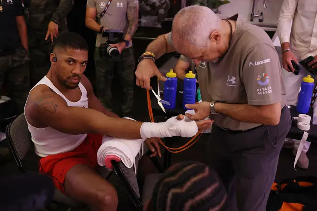 Anthony Joshua getting his hand wrapped