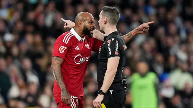 Marcao of Sevilla FC reacts after he is sent off by Referee, Alejandro Muniz