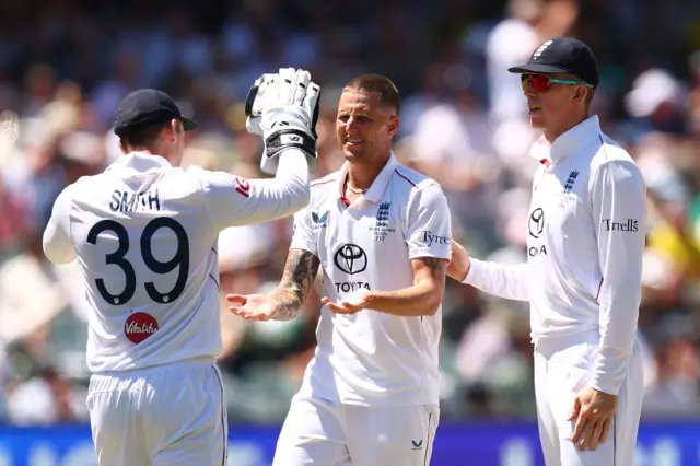 Brydon Carse celebrates the wicket of Pat Cummins