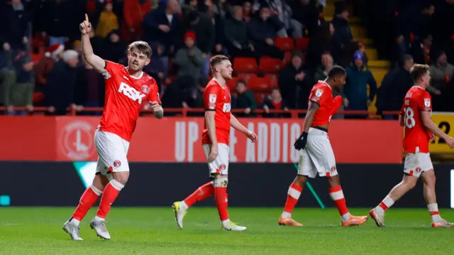 Charlton goalscorer Charlie Kelman raises his finger in celebration