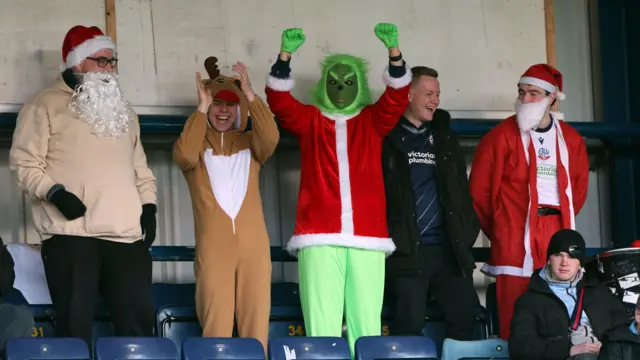 Fans in Christmas fancy dress