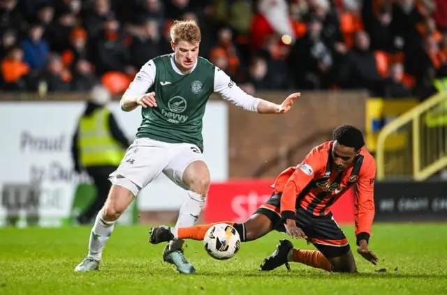 Hibernian's Zach Mitchell (left) and Dundee United's Amar Fatah