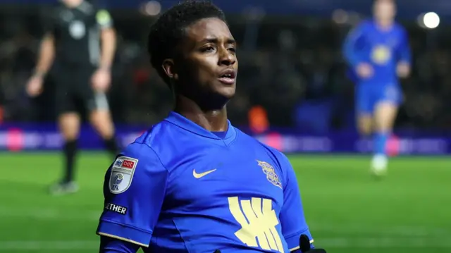 Demarai Gray sliding on his knees in celebration after scoring for Birmingham City.