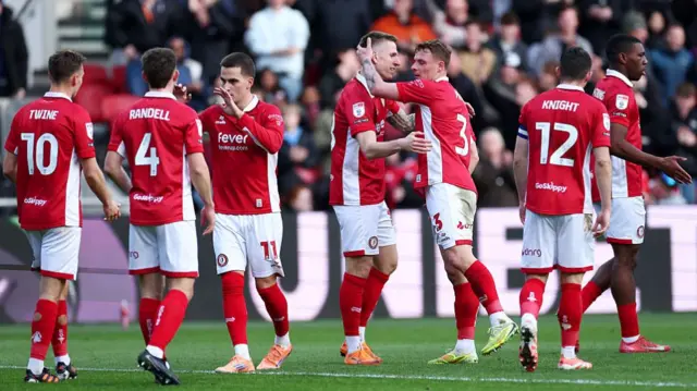 Bristol City players celebrate with goalscorer Emil Riis