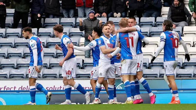 Blackburn players celebrate in front of their fans