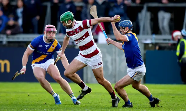 Slaughtneil’s Christopher McKaigue and Johnny Coen of Loughrea