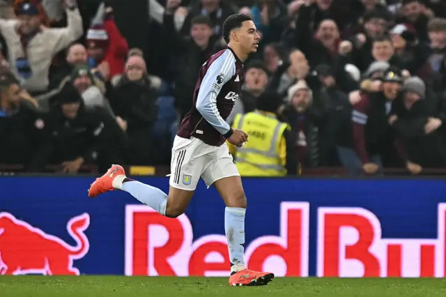 Aston Villa's English midfielder #27 Morgan Rogers celebrates scoring their second goal to take the lead 2-1 during the English Premier League football match between Aston Villa and Manchester United at Villa Park in Birmingham, central England on December 21, 2025.