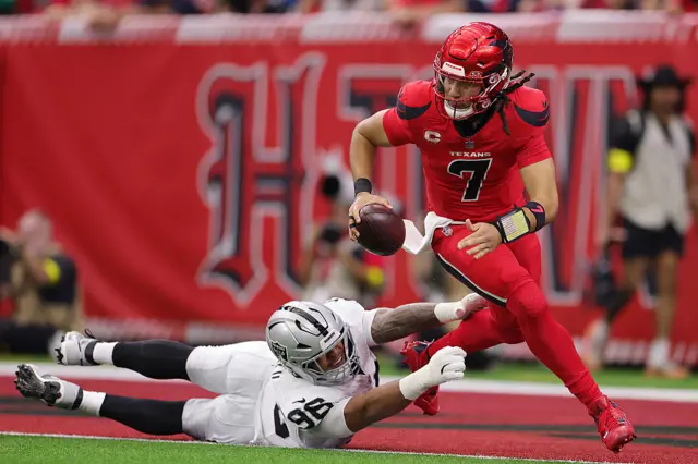 CJ Stroud is tackled by Maxx Crosby