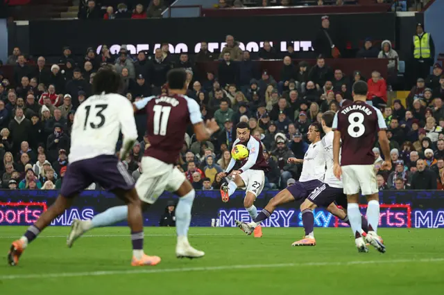 : Morgan Rogers of Aston Villa scores his team's first goal during the Premier League match between Aston Villa and Manchester United at Villa Park on December 21, 2025 in Birmingham, England.