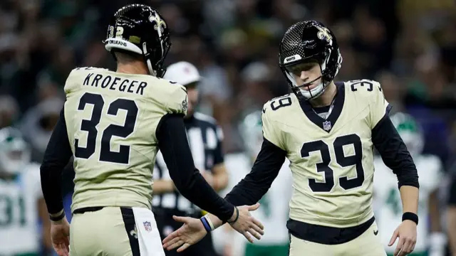 Kai Kroeger and Charlie Smyth of the New Orleans Saints celebrate after a field goal by Smyth against the New York Jets