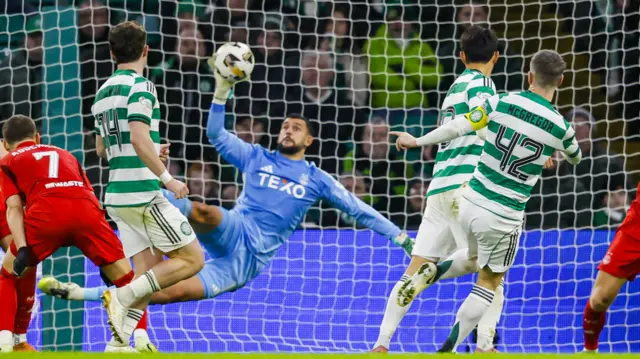 Aberdeen goalkeeper Dimitar Mitov makes a save to deny Celtic