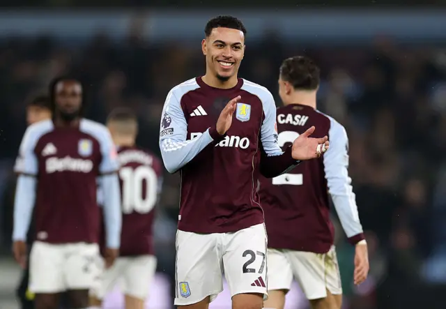 Morgan Rogers of Aston Villa applauds the fans