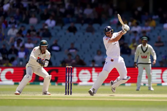 England’s Jamie Smith (right) bats as Australia's Alex Carey (left) watches from behind the stumps on day five of the third NRMA Insurance Ashes Series 2025 test at the Adelaide Oval, Australia