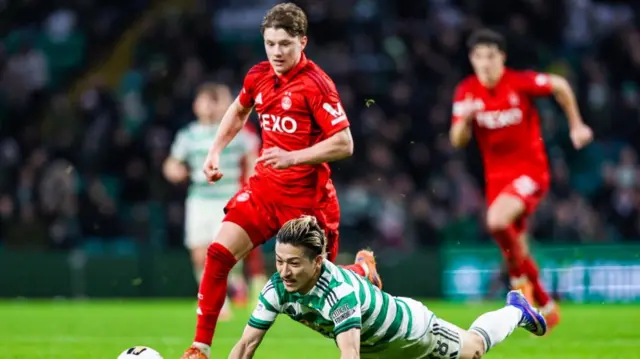 Aberdeen's Dylan Lobban fouls Celtic's Daizen Maeda