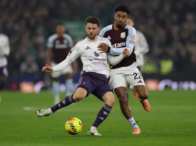 Manchester United's Mason Mount in action with Aston Villa's Ian Maatsen