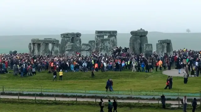 People gathring at Stonehenge