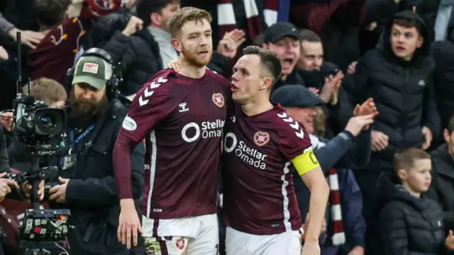 Hearts' Stuart Findlay and Lawrence Shankland celebrate