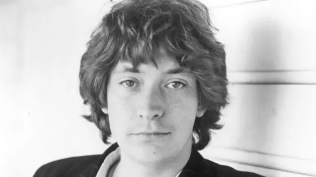 Rea as a young man in black and white