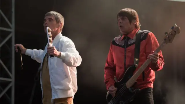 Mani with Brown at a gig