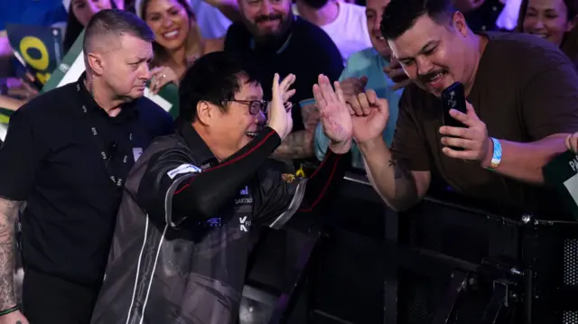 Paul Lim poses for a photo