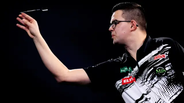 Gian van Veen throws a dart