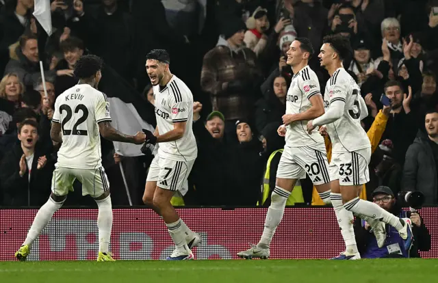 Fulham's Mexican striker #07 Raul Jimenez (2L) celebrates scoring the opening goal