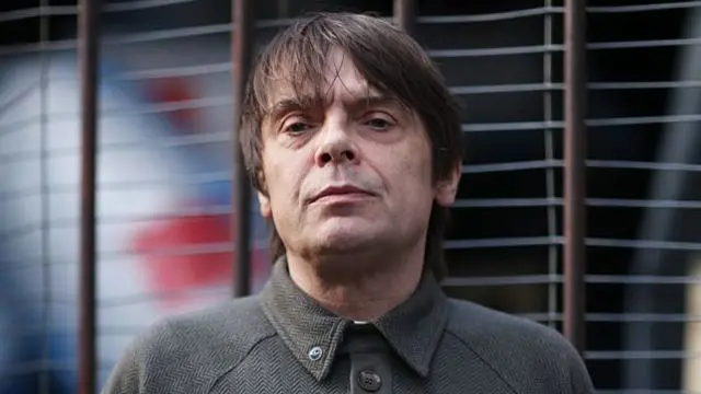 Mani looks to camera for a portrait picture in 2014