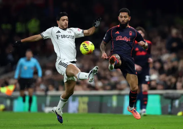 Fulham's Raul Jimenez in action with Nottingham Forest's Douglas Luiz