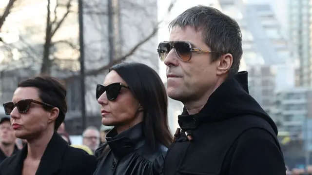 Liam Gallagher arrives at the funeral
