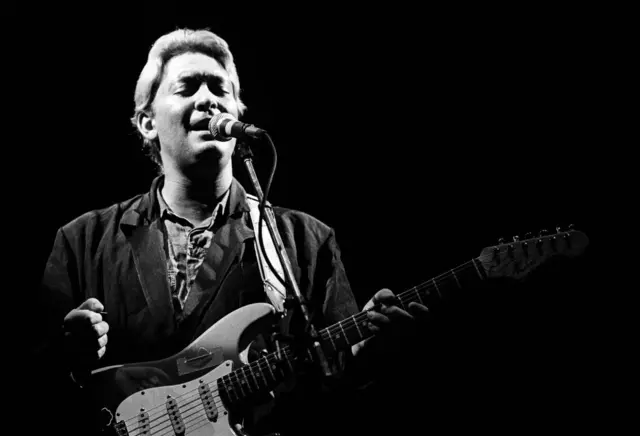 Chris Rea performs live on stage at Ahoy in Rotterdam, Netherlands on 25th November 1986.